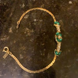 Faux emeralds in diamond gold tone bracelet